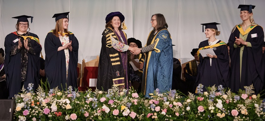 Penny shaking hands with chair of council